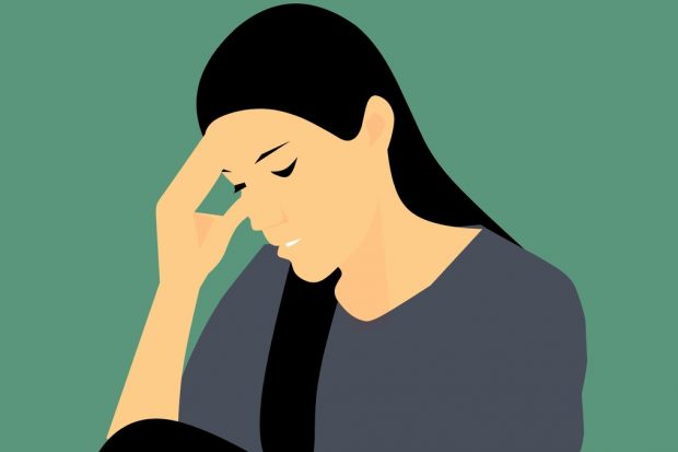 Image shows a stressed women